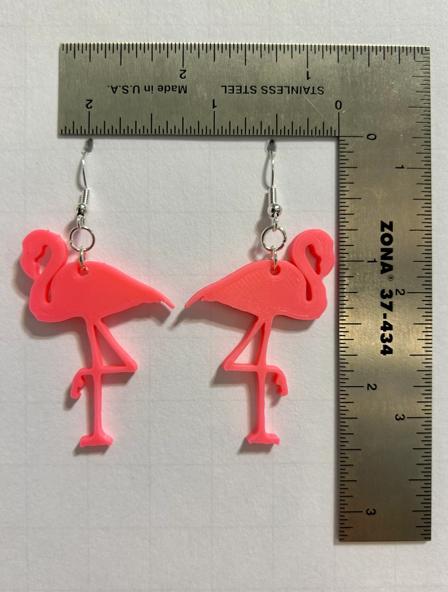Flamingo earrings with pink tropical bird design.