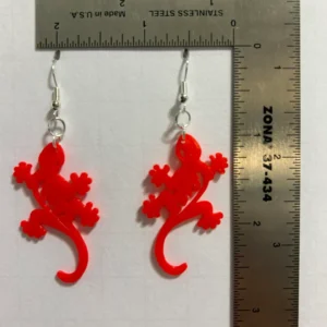 Gecko earrings featuring colorful reptile design.