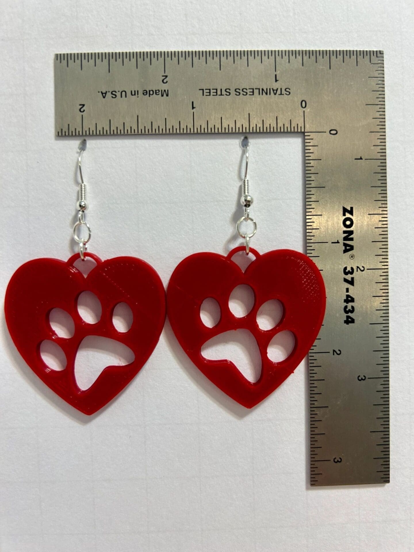 Heart paw earrings featuring heart and paw print combined design.