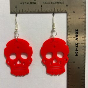 Sugar Skull earrings with colorful decorative patterns inspired by Halloween and Día de los Muertos.