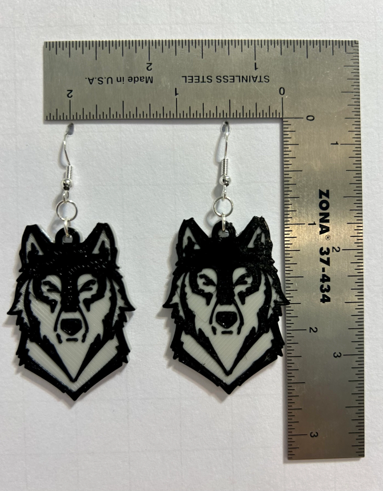 Wolf earrings featuring detailed wolf head design.