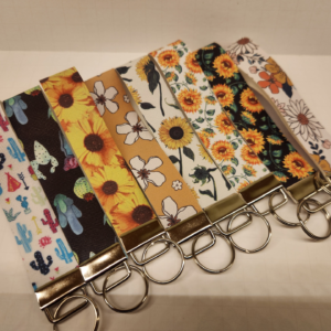 Lineup of Floral wristlets collection showing multiple colorful floral designs