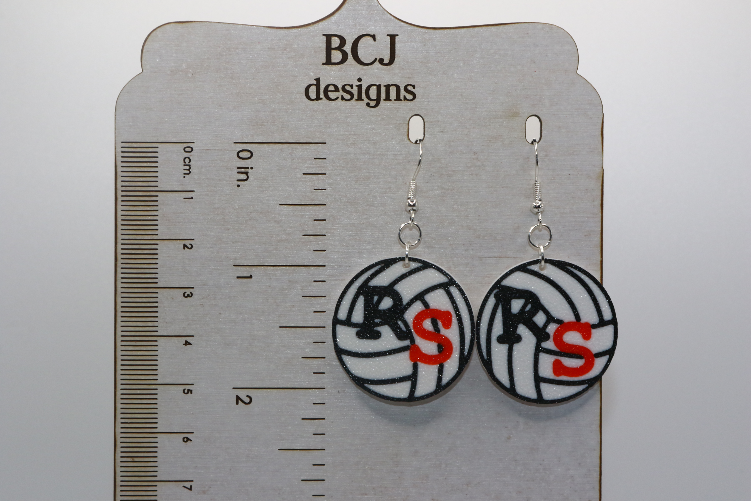 Volleyball earrings with orange and black RS lettering for Rising Sun fans