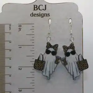 Earrings featuring stylish ghosts with leopard bags, bows, sunglasses, and coffee