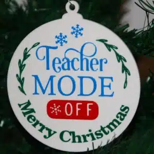 Teacher Christmas ornament with text “Teacher Mode Off,” colorful festive design.