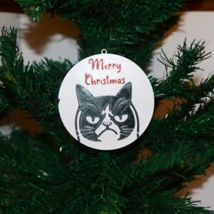 Grumpy Cat Christmas ornament with text “Merry Christmas,” colorful holiday theme.
