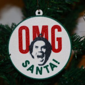 Elf Christmas ornament with Buddy’s shocked “OMG Santa” expression, festive design.