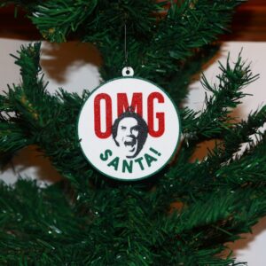 Elf Christmas ornament with Buddy’s shocked “OMG Santa” expression, festive design.