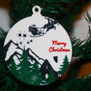 Santa Sleigh Christmas ornament flying over a snowy winter house with twinkling lights.