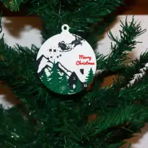 Santa Sleigh Christmas ornament flying over a snowy winter house with twinkling lights.