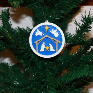 Nativity Christmas ornament with two angels and a star, elegant festive design.