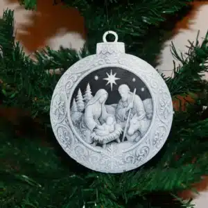 Nativity Scene Christmas ornament with Mary, Joseph, baby Jesus, donkey, trees, and night sky.