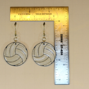 Pair of earrings shaped like a white volleyball with black lines.