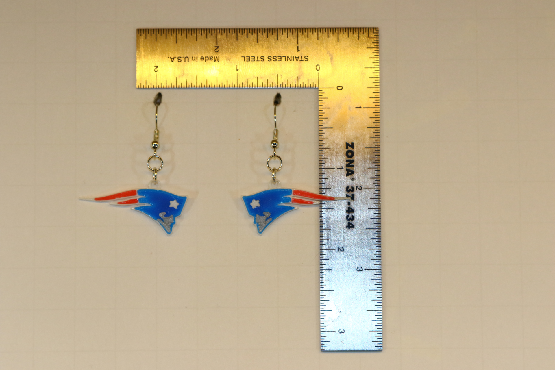 Pair of earrings featuring the New England Patriots logo in blue, red, and white.