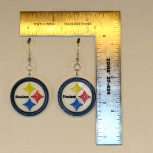 Pair of earrings featuring the Pittsburgh Steelers logo in black, gold, and white.
