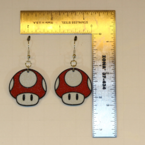 Pair of red and white Mario power-up mushroom earrings.