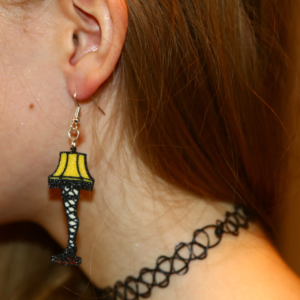 Pair of leg lamp Christmas earrings with detailed lampshade.