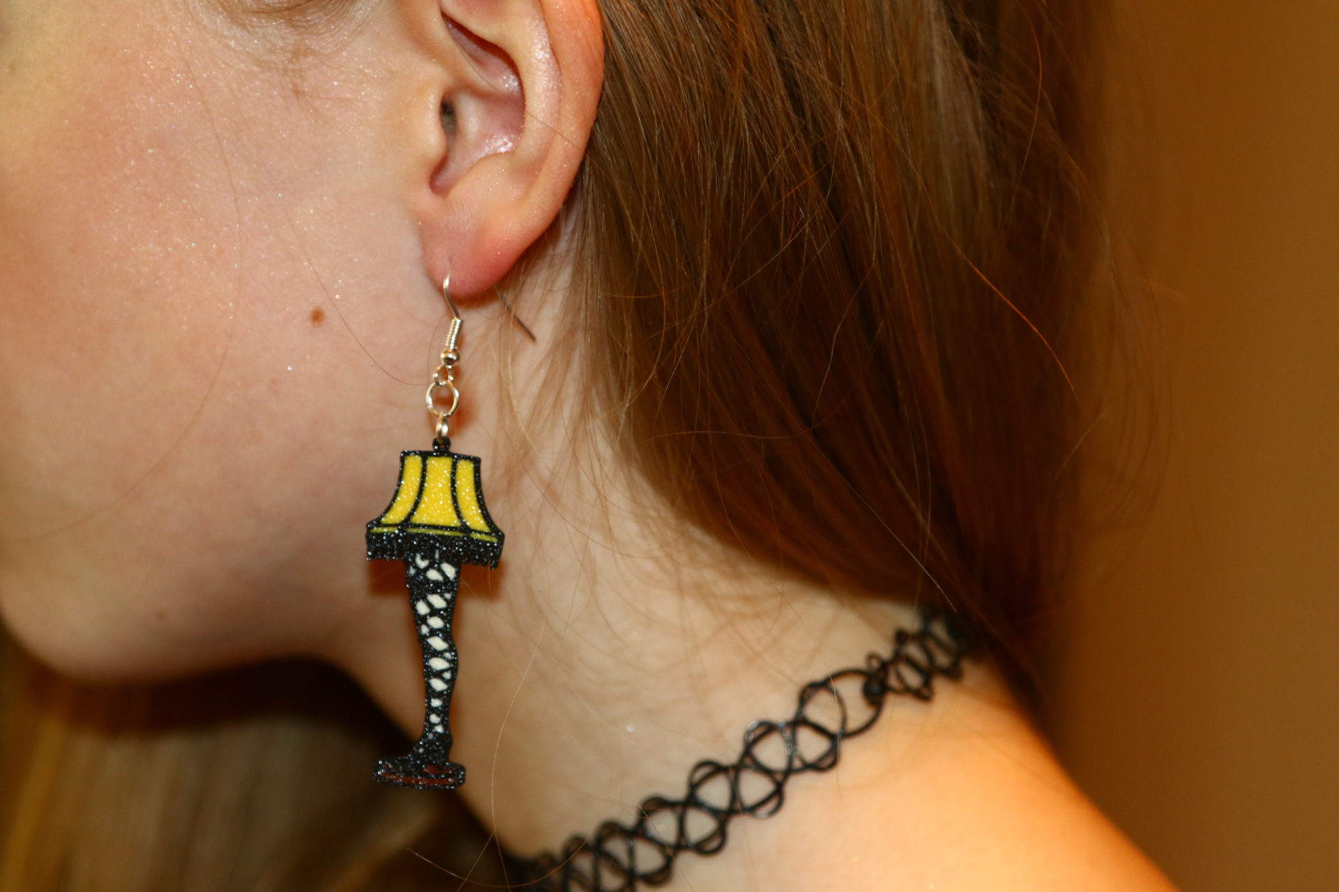 Pair of leg lamp Christmas earrings with detailed lampshade.