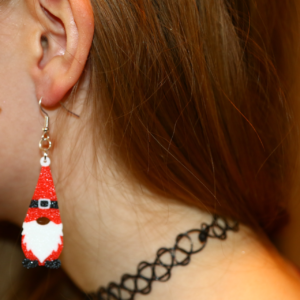 Pair of Santa gnome earrings with red hat and white beard.