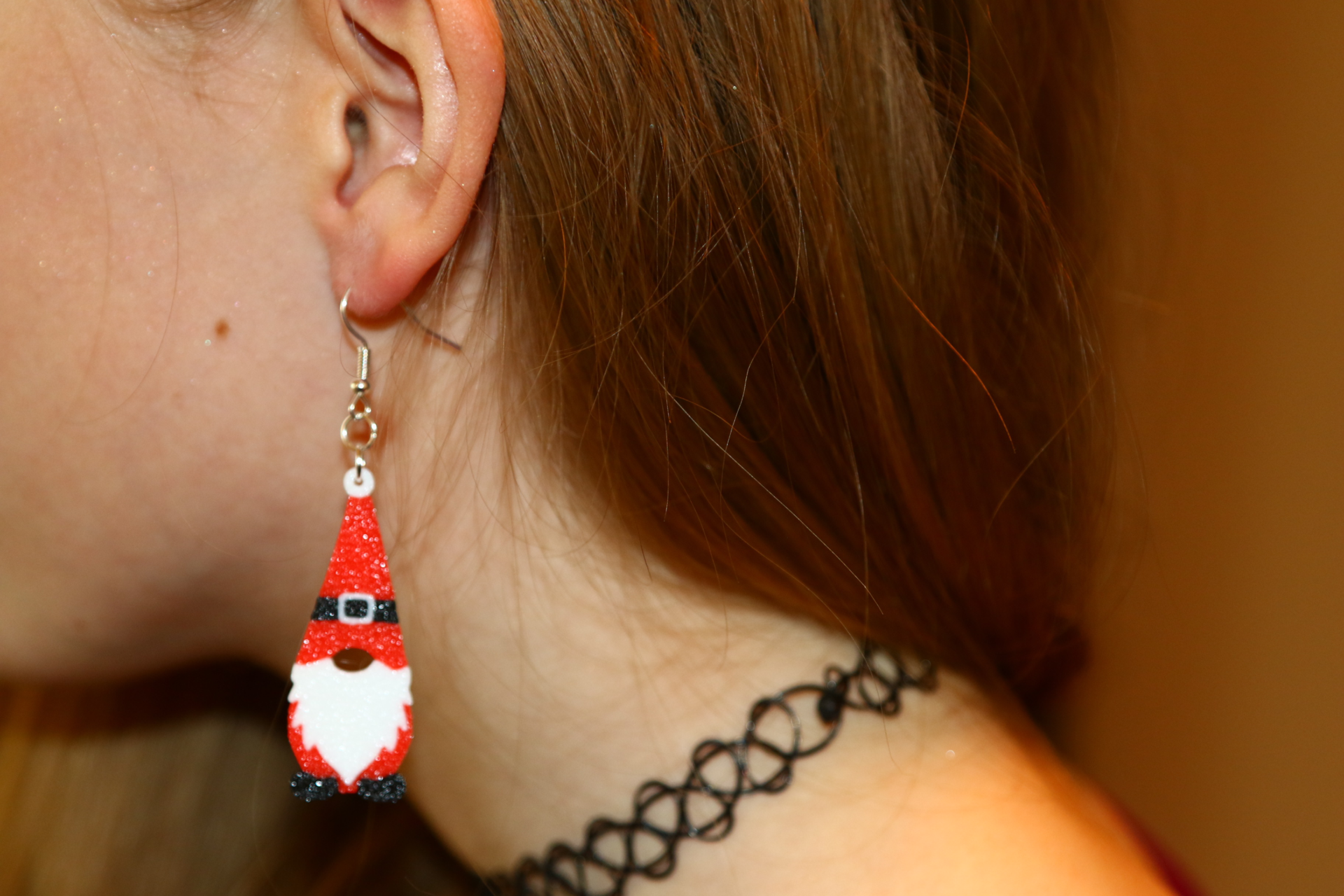 Pair of Santa gnome earrings with red hat and white beard.