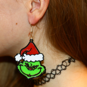 Pair of Grinch earrings with green and red accents.