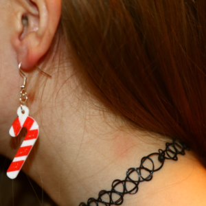 Pair of red and white striped candy cane earrings.