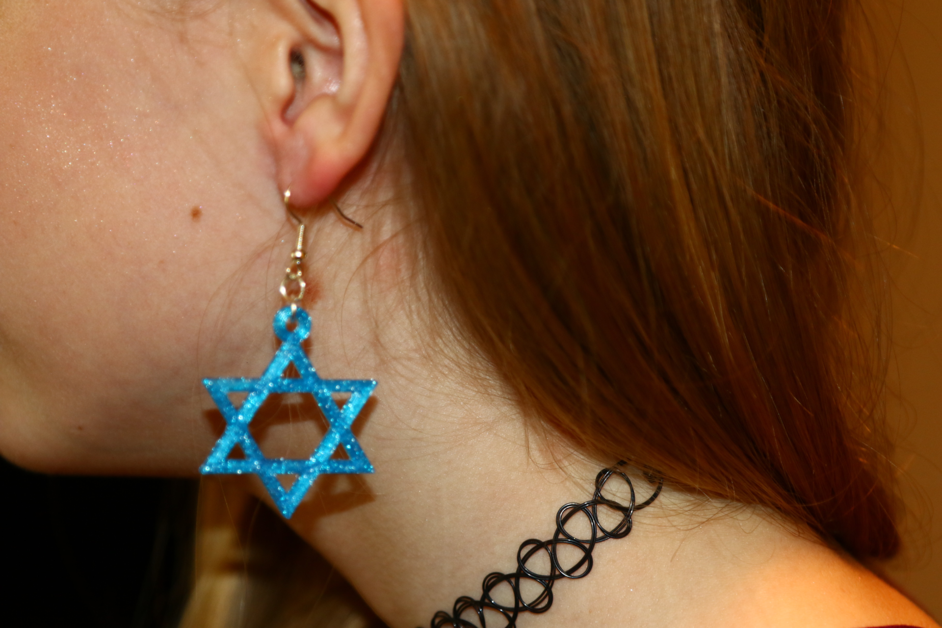 Star of David Hanukkah earrings in a polished silver finish.