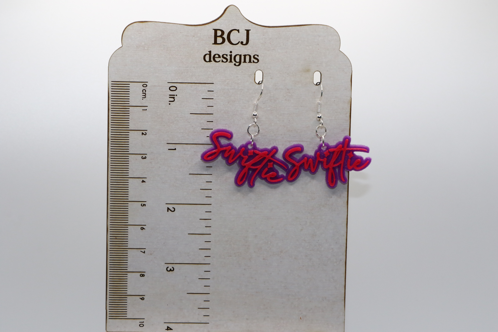 Pair of “Swiftie” earrings in bold lettering with silver hooks