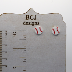 Pair of small stud earrings shaped like a baseball with red stitching.