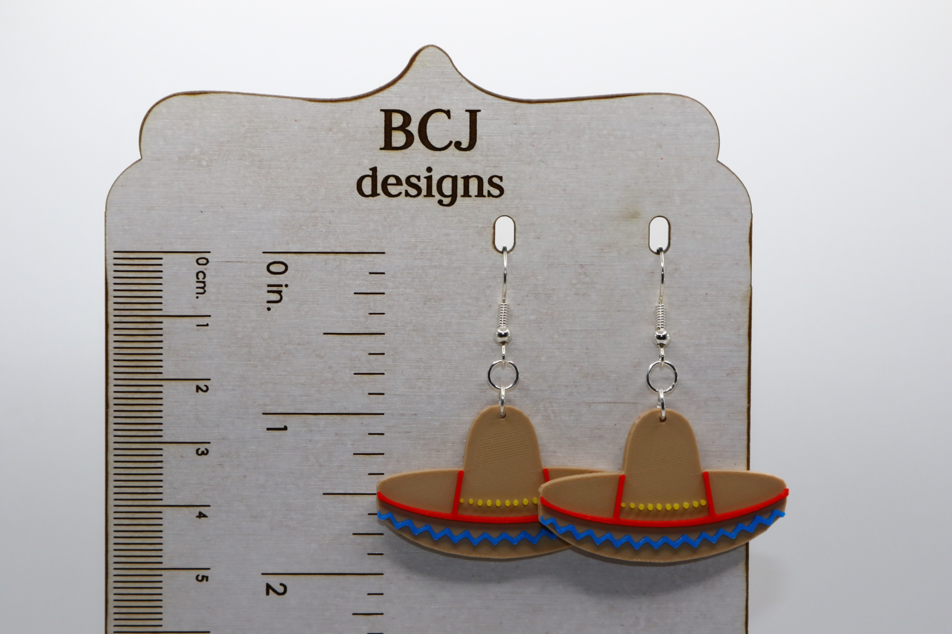 Colorful sombrero-shaped earrings for Cinco de Mayo.