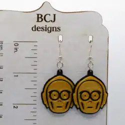 Pair of gold droid earrings resembling Star Wars’ C-3PO.