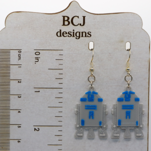 Pair of blue and white R2-D2 droid earrings with silver hooks.