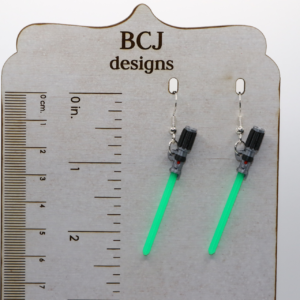 Pair of colorful lightsaber earrings with silver hooks.