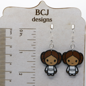 Princess Leia earrings with brown hair bun design.