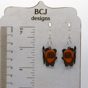 Pair of earrings shaped like smiling brown Ewoks from Star Wars.