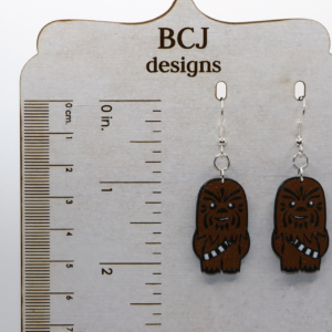 Chewbacca earrings with brown fur and friendly face design.