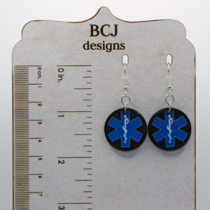 Pair of earrings featuring symbols representing police, fire, and medical first responders.