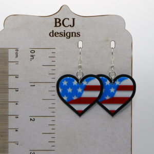 Pair of heart-shaped earrings with American flag stars and stripes.
