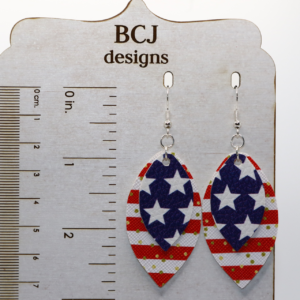 Pair of faux leather star earrings in red, white, and blue pattern.