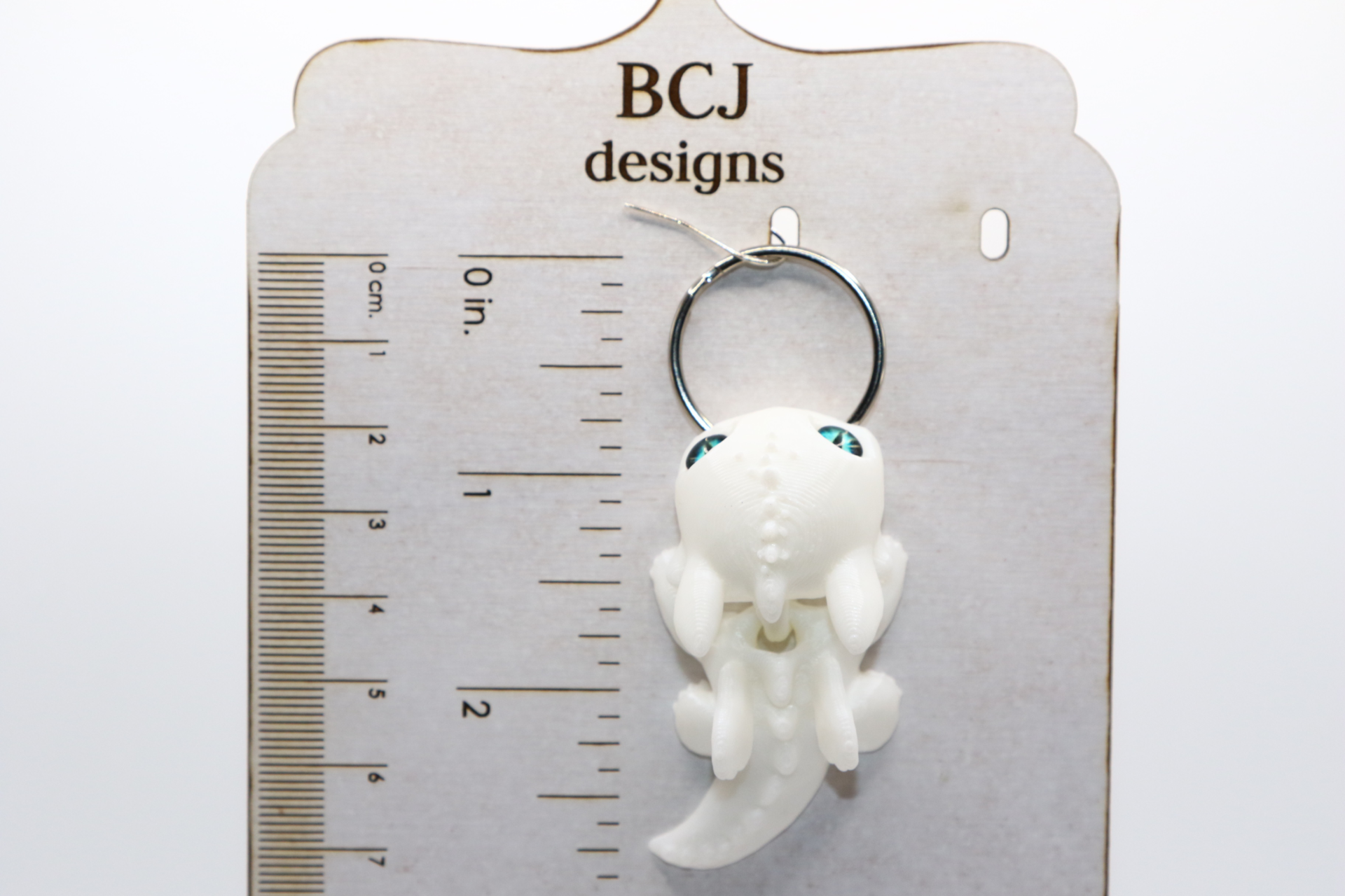 White Fury dragon keychain with sleek white design