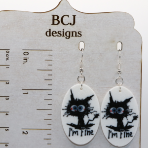 Pair of “I’m Fine” cat earrings showing a cartoon cat on fire.
