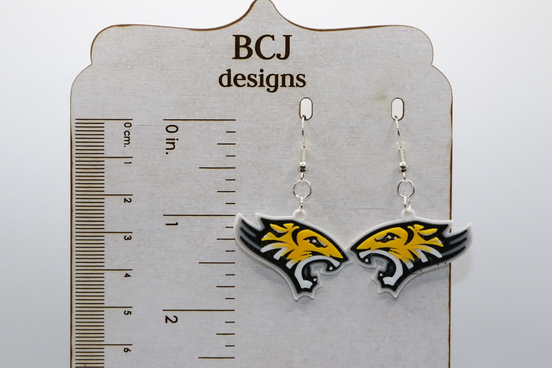 Pair of earrings featuring the Towson University Tiger mascot in black and gold.