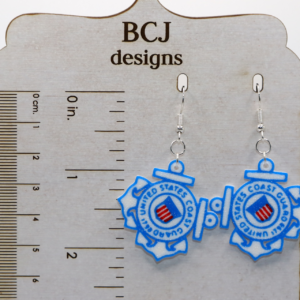 Pair of earrings featuring the U.S. Coast Guard emblem with red, white, and blue accents.