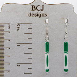 Pair of earrings featuring a set of colorful school markers in red, blue, green, and yellow.