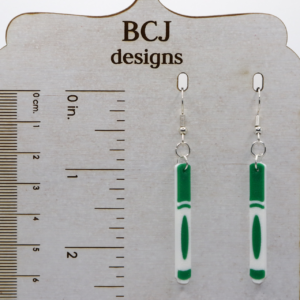 Pair of earrings featuring a set of colorful school markers in red, blue, green, and yellow.