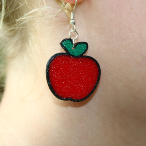 Pair of earrings shaped like a bright red apple with a green leaf.