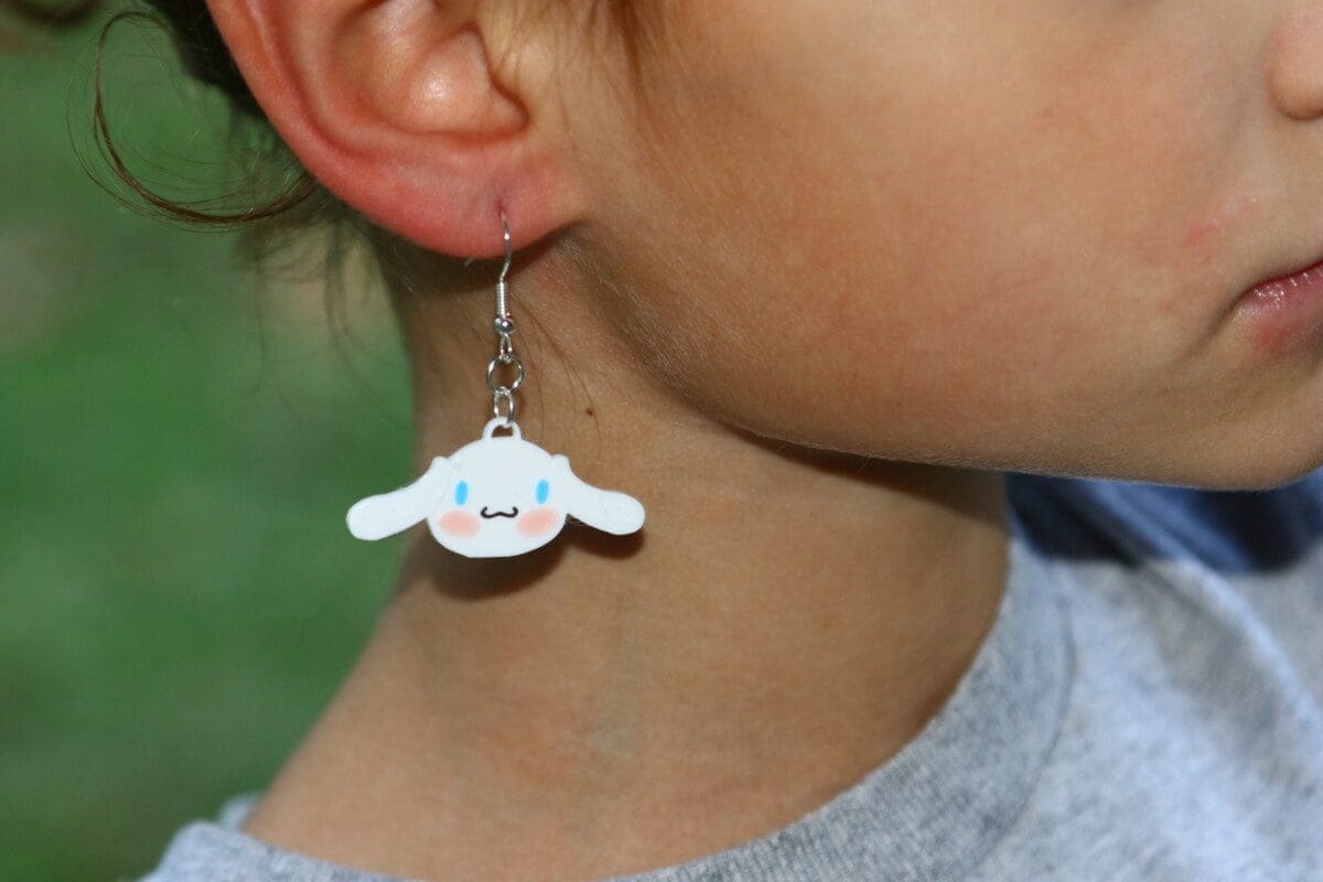 Cinnamoroll earrings with white puppy and blue ear details.