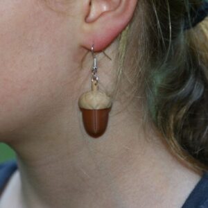Acorn-shaped earrings in warm brown tones with natural detail.