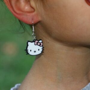 Hello Kitty earrings with red bow and white face design.