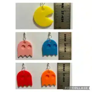 Pair of earrings featuring Pac-Man character and colorful ghosts.